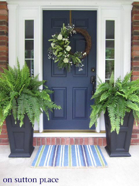 fern topiaries on the front porch