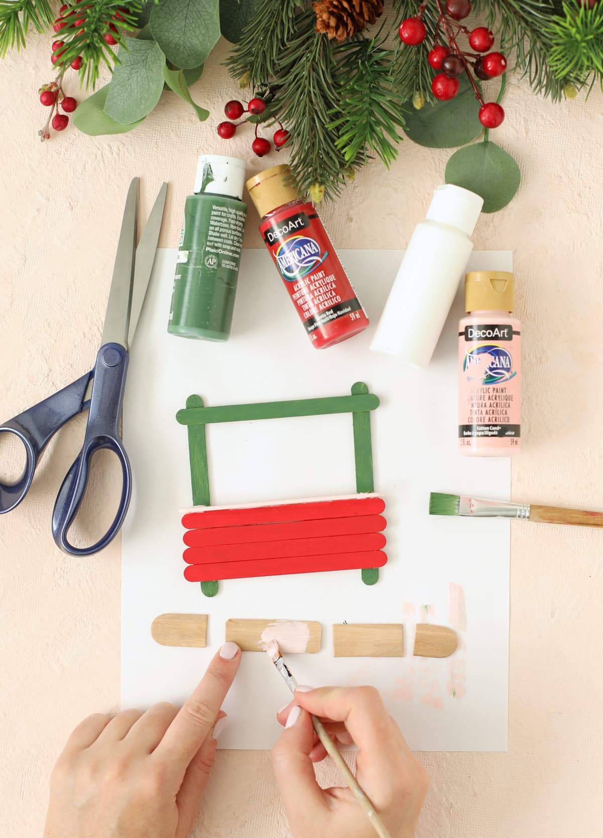 cut a jumbo popsicle stick apart to make a shop sign