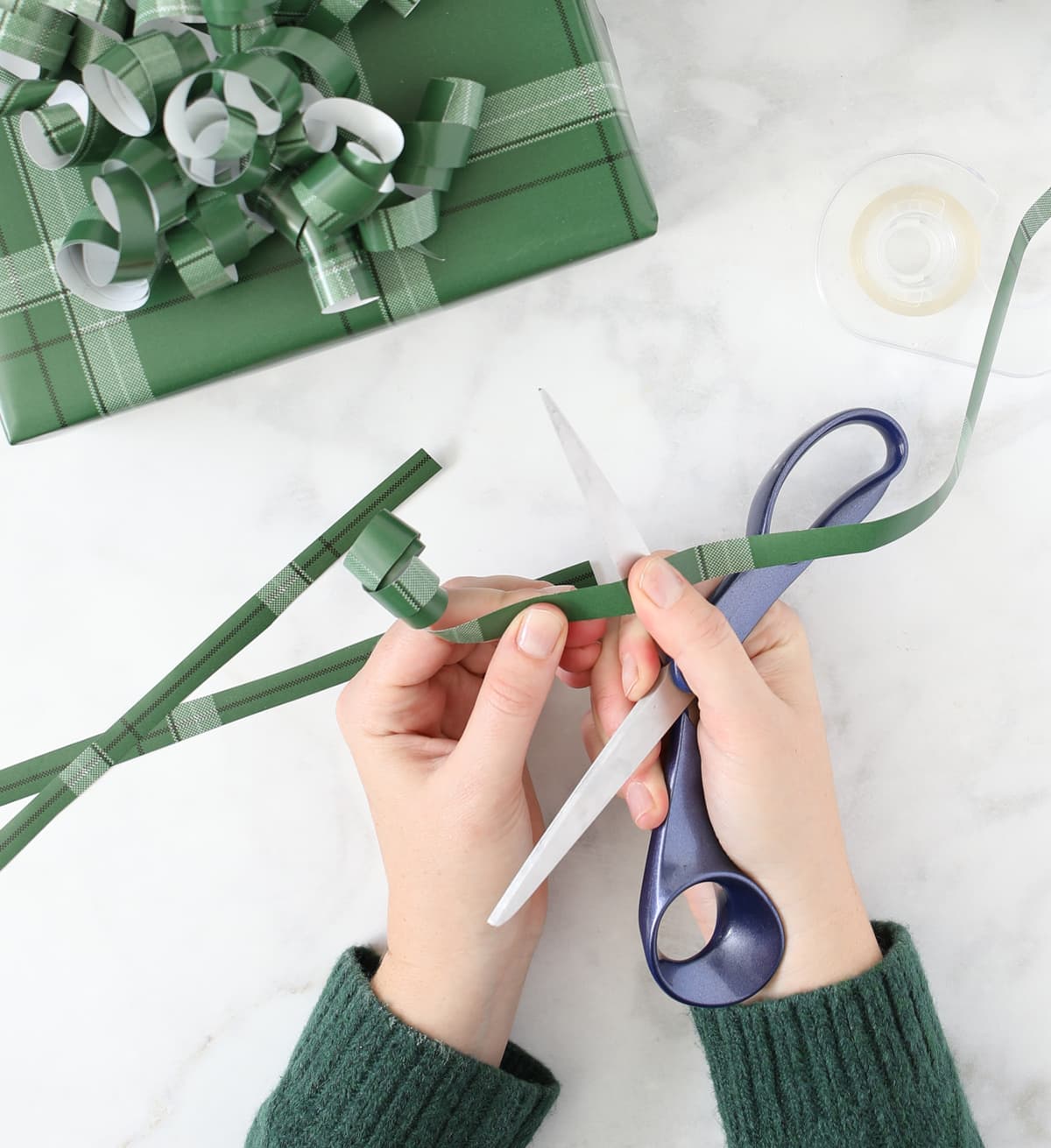 curling wrapping paper to make a bow